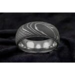 Men’s Damascus Steel Band Ring – Balanced Weight with Classic Forged Style, Handmade Personalized Anniversary Gift SetDiscover the timeless appeal of handcrafted metalwork with this artisan men’s Damascus steel band ring from Alfa Cutlery. Designed with a balanced weight and classic forged style, this ring combines a refined appearance with the distinctive character of handmade Damascus steel.  The ring features a personalization option, making it a thoughtful choice for anniversaries, weddings, and other memorable occasions. Customers can also submit their own logo for customization, subject to review of the requested design and feasibility.  Presented as a ring gift set, this handcrafted Damascus steel band makes a distinctive and meaningful gift for men who appreciate classic forged craftsmanship.  3. Product Details Product Type: Ring Gift Set Material: Damascus Steel Style: Anniversary Gift Feature: Personalization Technique: Handmade Application: Damascus Ring Printing: Not Applicable Design: Classic Forged Style Weight: Balanced Weight Type: Damascus Steel Band Ring Customization: Personalization Option Logo: Accept Customer's Logo Shipping: DHL