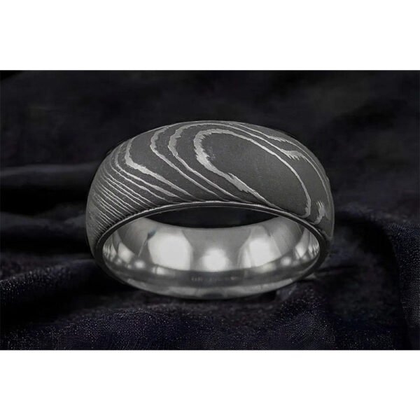Men’s Damascus Steel Band Ring – Balanced Weight with Classic Forged Style, Handmade Personalized Anniversary Gift SetDiscover the timeless appeal of handcrafted metalwork with this artisan men’s Damascus steel band ring from Alfa Cutlery. Designed with a balanced weight and classic forged style, this ring combines a refined appearance with the distinctive character of handmade Damascus steel.  The ring features a personalization option, making it a thoughtful choice for anniversaries, weddings, and other memorable occasions. Customers can also submit their own logo for customization, subject to review of the requested design and feasibility.  Presented as a ring gift set, this handcrafted Damascus steel band makes a distinctive and meaningful gift for men who appreciate classic forged craftsmanship.  3. Product Details Product Type: Ring Gift Set Material: Damascus Steel Style: Anniversary Gift Feature: Personalization Technique: Handmade Application: Damascus Ring Printing: Not Applicable Design: Classic Forged Style Weight: Balanced Weight Type: Damascus Steel Band Ring Customization: Personalization Option Logo: Accept Customer's Logo Shipping: DHL