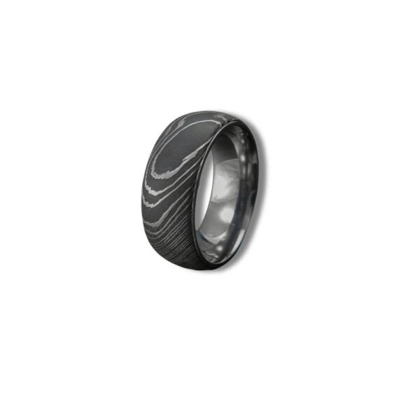 Men’s Damascus Steel Band Ring – Balanced Weight with Classic Forged Style, Handmade Personalized Anniversary Gift SetDiscover the timeless appeal of handcrafted metalwork with this artisan men’s Damascus steel band ring from Alfa Cutlery. Designed with a balanced weight and classic forged style, this ring combines a refined appearance with the distinctive character of handmade Damascus steel.  The ring features a personalization option, making it a thoughtful choice for anniversaries, weddings, and other memorable occasions. Customers can also submit their own logo for customization, subject to review of the requested design and feasibility.  Presented as a ring gift set, this handcrafted Damascus steel band makes a distinctive and meaningful gift for men who appreciate classic forged craftsmanship.  3. Product Details Product Type: Ring Gift Set Material: Damascus Steel Style: Anniversary Gift Feature: Personalization Technique: Handmade Application: Damascus Ring Printing: Not Applicable Design: Classic Forged Style Weight: Balanced Weight Type: Damascus Steel Band Ring Customization: Personalization Option Logo: Accept Customer's Logo Shipping: DHL
