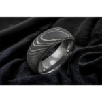 Men’s Damascus Steel Band Ring – Balanced Weight with Classic Forged Style, Handmade Personalized Anniversary Gift SetDiscover the timeless appeal of handcrafted metalwork with this artisan men’s Damascus steel band ring from Alfa Cutlery. Designed with a balanced weight and classic forged style, this ring combines a refined appearance with the distinctive character of handmade Damascus steel.  The ring features a personalization option, making it a thoughtful choice for anniversaries, weddings, and other memorable occasions. Customers can also submit their own logo for customization, subject to review of the requested design and feasibility.  Presented as a ring gift set, this handcrafted Damascus steel band makes a distinctive and meaningful gift for men who appreciate classic forged craftsmanship.  3. Product Details Product Type: Ring Gift Set Material: Damascus Steel Style: Anniversary Gift Feature: Personalization Technique: Handmade Application: Damascus Ring Printing: Not Applicable Design: Classic Forged Style Weight: Balanced Weight Type: Damascus Steel Band Ring Customization: Personalization Option Logo: Accept Customer's Logo Shipping: DHL