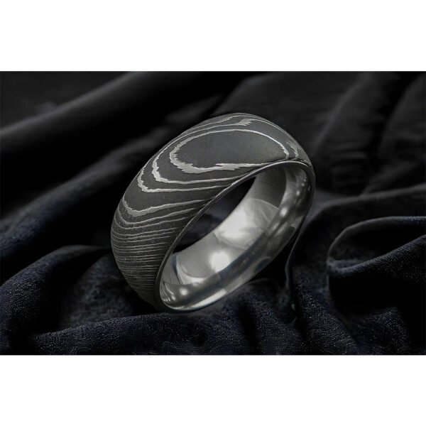 Men’s Damascus Steel Band Ring – Balanced Weight with Classic Forged Style, Handmade Personalized Anniversary Gift SetDiscover the timeless appeal of handcrafted metalwork with this artisan men’s Damascus steel band ring from Alfa Cutlery. Designed with a balanced weight and classic forged style, this ring combines a refined appearance with the distinctive character of handmade Damascus steel.  The ring features a personalization option, making it a thoughtful choice for anniversaries, weddings, and other memorable occasions. Customers can also submit their own logo for customization, subject to review of the requested design and feasibility.  Presented as a ring gift set, this handcrafted Damascus steel band makes a distinctive and meaningful gift for men who appreciate classic forged craftsmanship.  3. Product Details Product Type: Ring Gift Set Material: Damascus Steel Style: Anniversary Gift Feature: Personalization Technique: Handmade Application: Damascus Ring Printing: Not Applicable Design: Classic Forged Style Weight: Balanced Weight Type: Damascus Steel Band Ring Customization: Personalization Option Logo: Accept Customer's Logo Shipping: DHL